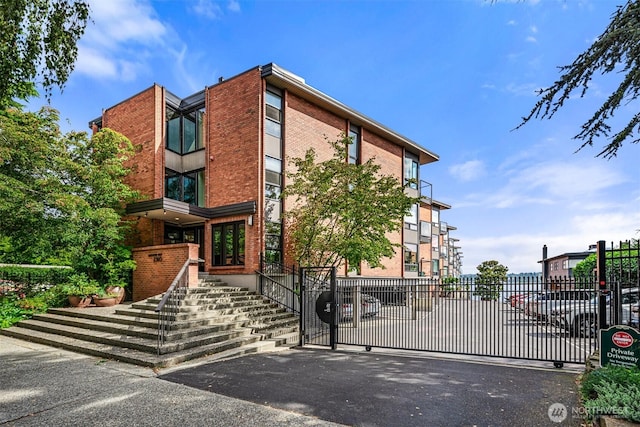 2360 43rd Ave E Unit 213, Seattle, WA 98112 - view of building exterior with stairs