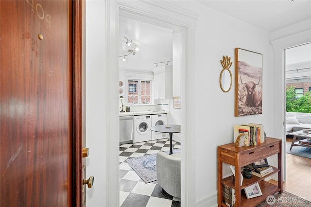 100 W Highland Dr Unit 404, Seattle, WA 98119 - corridor with washer / clothes dryer and tile patterned floors