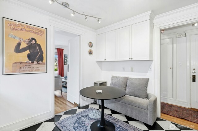 100 W Highland Dr Unit 404, Seattle, WA 98119 - living area with tile patterned floors, ornamental molding, and baseboards