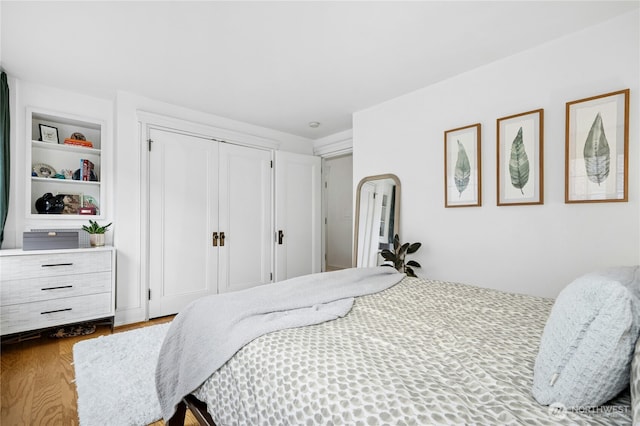 100 W Highland Dr Unit 404, Seattle, WA 98119 - bedroom with wood finished floors and a closet