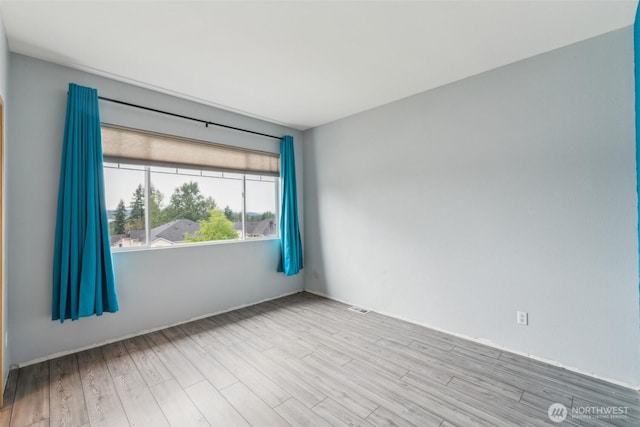 4724 Mill Pond Dr SE Unit 702, Auburn, WA 98092 - unfurnished room featuring wood finished floors