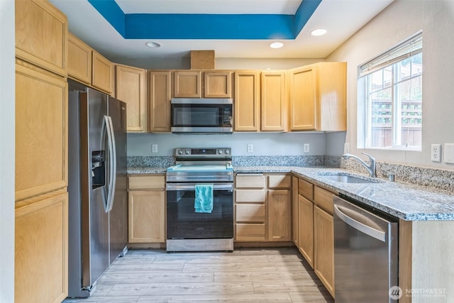 4724 Mill Pond Dr SE Unit 702, Auburn, WA 98092 - kitchen with stainless steel appliances, a sink, light brown cabinetry, recessed lighting, and light stone counters
