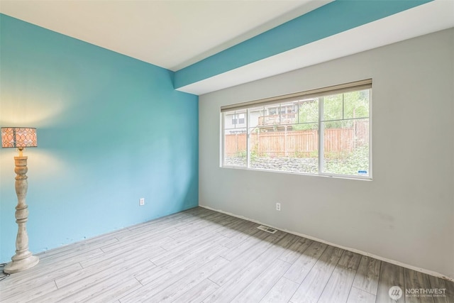 4724 Mill Pond Dr SE Unit 702, Auburn, WA 98092 - empty room with wood finished floors and baseboards