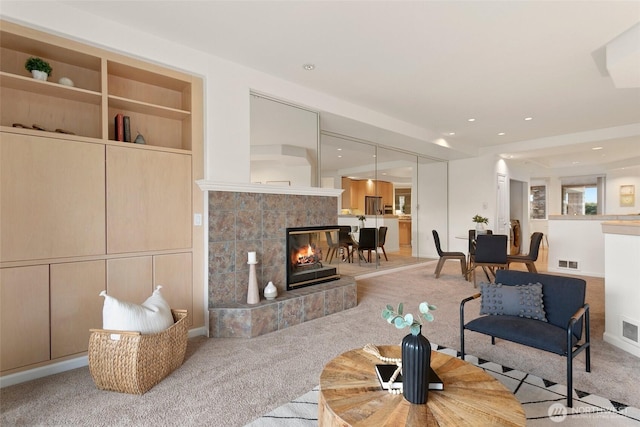 3900 2nd Ave NE Unit 204, Seattle, WA 98105 - living room featuring carpet and a fireplace