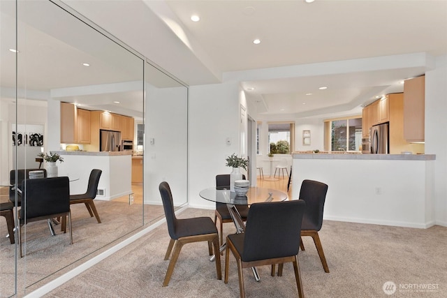 3900 2nd Ave NE Unit 204, Seattle, WA 98105 - dining room with light carpet and recessed lighting