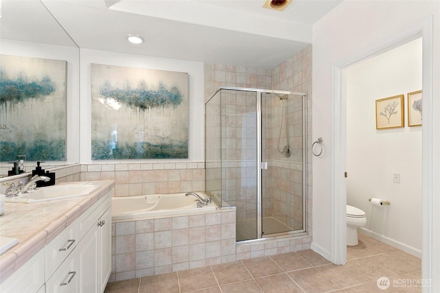 3900 2nd Ave NE Unit 204, Seattle, WA 98105 - full bath featuring tile patterned floors, a shower stall, a bath, double vanity, and toilet