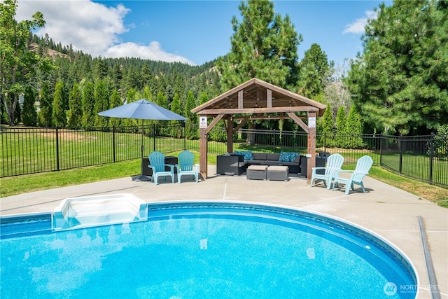 10552 Ski Hill Dr, Leavenworth, WA 98826 - view of swimming pool with a gazebo, outdoor lounge area, a patio, and a wooded view