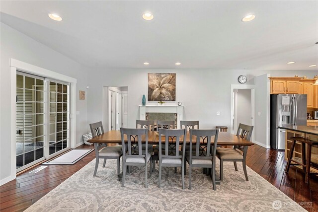 10552 Ski Hill Dr, Leavenworth, WA 98826 - dining area with a fireplace, dark wood-style floors, baseboards, and recessed lighting