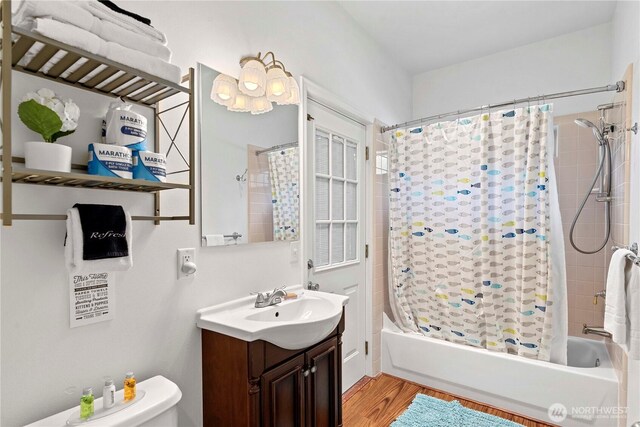 10552 Ski Hill Dr, Leavenworth, WA 98826 - full bathroom featuring vanity, shower / bath combination with curtain, wood finished floors, and toilet