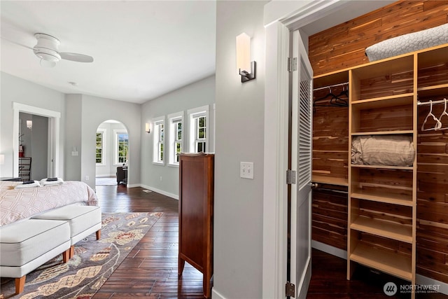 10552 Ski Hill Dr, Leavenworth, WA 98826 - interior space featuring arched walkways, dark wood-type flooring, and baseboards