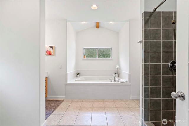 10552 Ski Hill Dr, Leavenworth, WA 98826 - bathroom with a bath, lofted ceiling, a tile shower, vanity, and tile patterned flooring