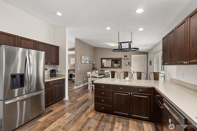 202 Abram Ln, Chehalis, WA 98532 - kitchen with appliances with stainless steel finishes, light countertops, a peninsula, dark brown cabinetry, and recessed lighting