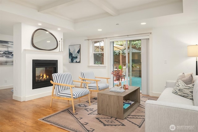 1414 1st Ave W Unit 104, Seattle, WA 98119 - sitting room with recessed lighting, beamed ceiling, light wood-style flooring, and a glass covered fireplace