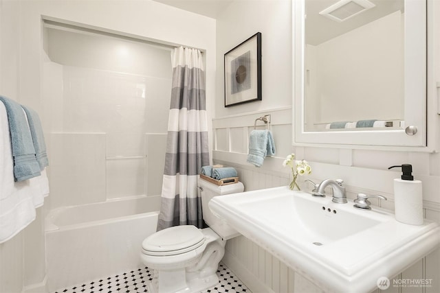 1414 1st Ave W Unit 104, Seattle, WA 98119 - full bathroom with shower / tub combo with curtain and tile patterned flooring
