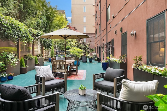 1414 1st Ave W Unit 104, Seattle, WA 98119 - view of patio featuring outdoor dining area and an outdoor hangout area