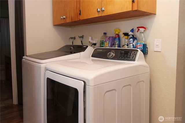 1625 E 61st St, Tacoma, WA 98404 - washroom featuring washing machine and clothes dryer, cabinet space, and a textured wall