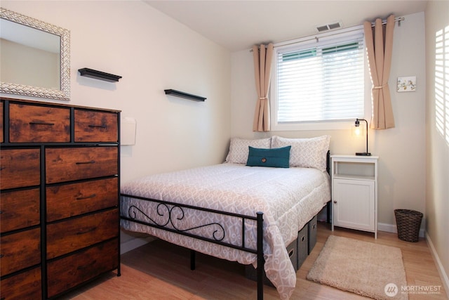 1625 E 61st St, Tacoma, WA 98404 - bedroom featuring light wood-style flooring, multiple windows, and baseboards