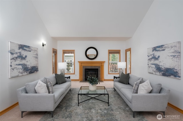 18311 Burn Rd, Arlington, WA 98223 - living area with healthy amount of natural light, baseboards, lofted ceiling, a tile fireplace, and carpet