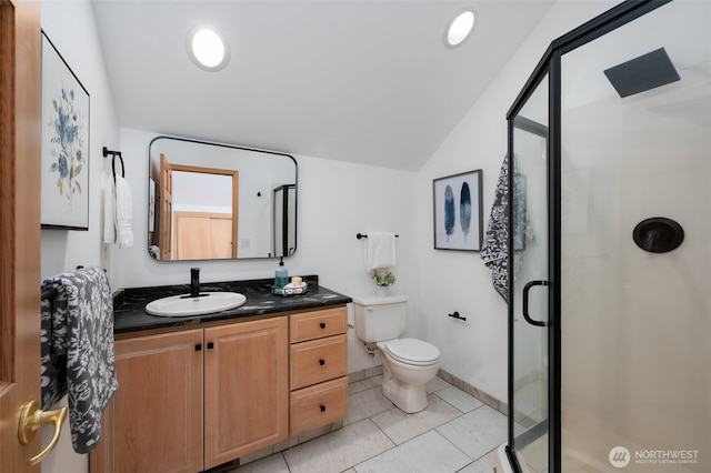 18311 Burn Rd, Arlington, WA 98223 - bathroom with lofted ceiling, a shower stall, vanity, toilet, and tile patterned flooring