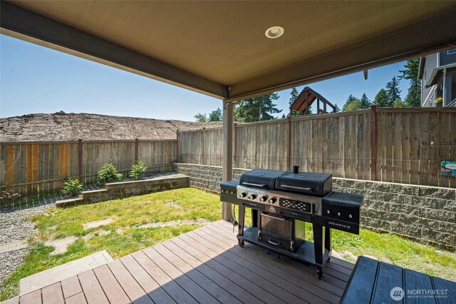 627 68th Ave E, Tacoma, WA 98424 - wooden deck featuring area for grilling and a fenced backyard