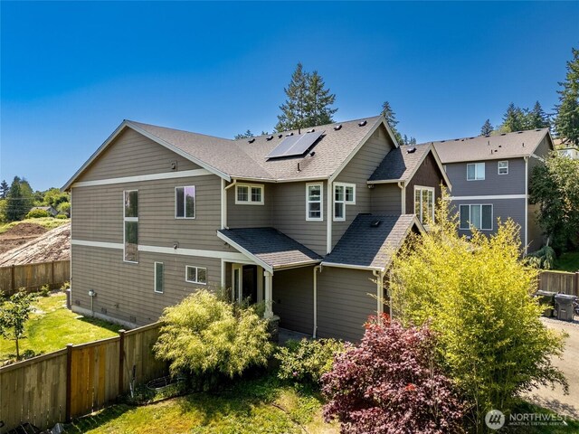 627 68th Ave E, Tacoma, WA 98424 - back of house with roof mounted solar panels and a shingled roof