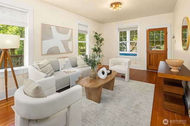 4819 S Lucile St, Seattle, WA 98118 - living room with wood finished floors, plenty of natural light, and baseboards