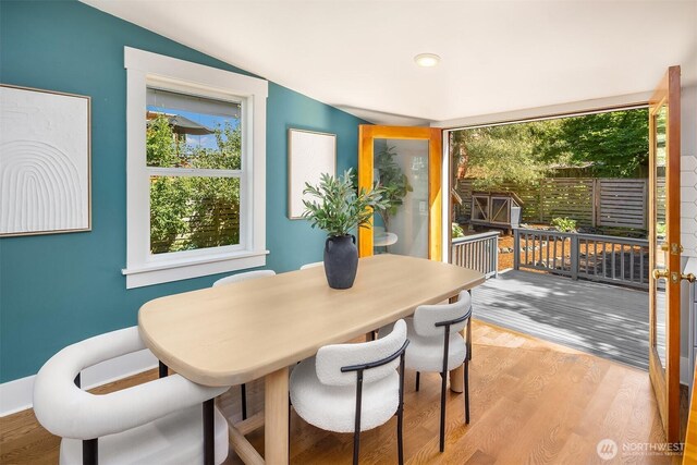 4819 S Lucile St, Seattle, WA 98118 - dining area with healthy amount of natural light, vaulted ceiling, and light wood-style floors