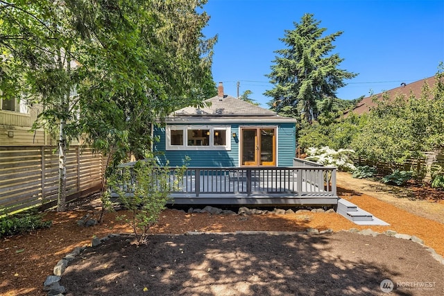 4819 S Lucile St, Seattle, WA 98118 - back of house with a deck, roof with shingles, and a chimney