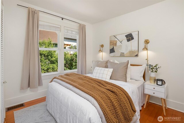 4819 S Lucile St, Seattle, WA 98118 - bedroom featuring wood finished floors and baseboards