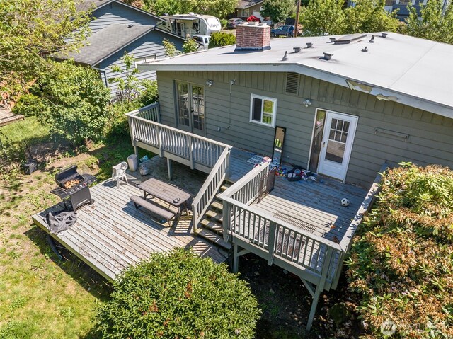 2134 SW 339th St, Federal Way, WA 98023 - back of property with a wooden deck, a chimney, and a fire pit