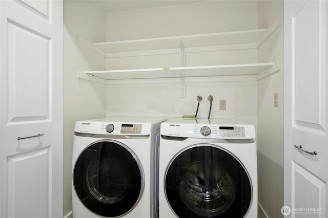12721 NE 116th St Unit F102, Kirkland, WA 98034 - washroom with washing machine and dryer and baseboards