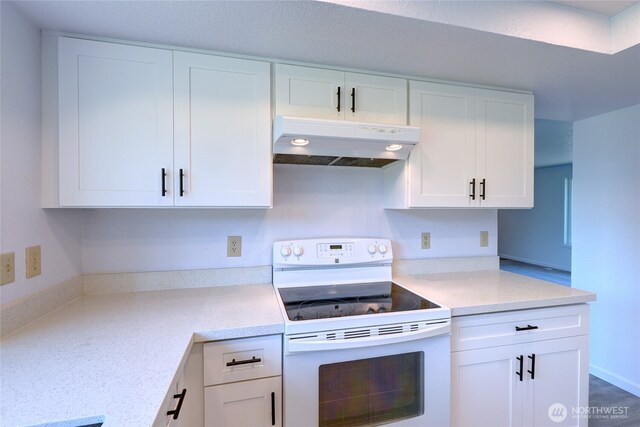 2320 183rd Street Ct E, Tacoma, WA 98445 - kitchen with electric range, under cabinet range hood, white cabinetry, and light countertops