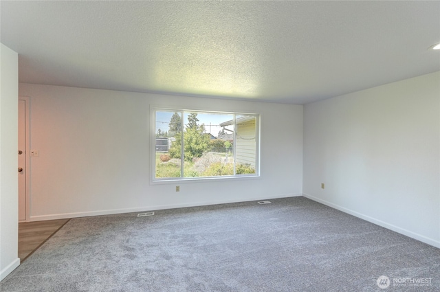 2320 183rd Street Ct E, Tacoma, WA 98445 - spare room featuring carpet floors, baseboards, and a textured ceiling
