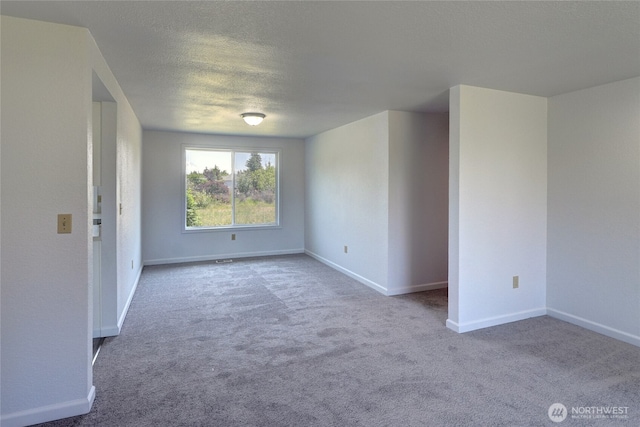 2320 183rd Street Ct E, Tacoma, WA 98445 - carpeted empty room with baseboards and a textured ceiling