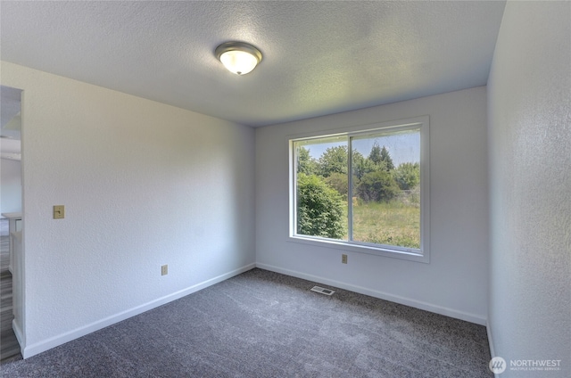 2320 183rd Street Ct E, Tacoma, WA 98445 - carpeted spare room with a textured wall, baseboards, and a textured ceiling