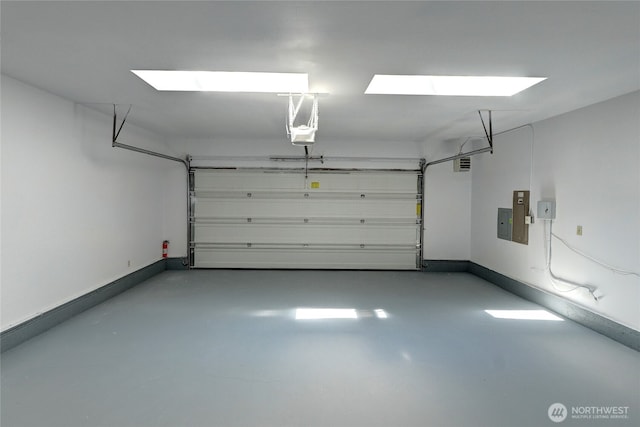 2320 183rd Street Ct E, Tacoma, WA 98445 - garage featuring baseboards and electric panel
