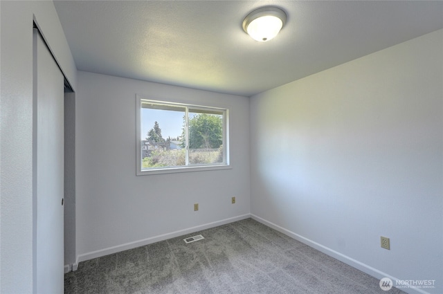 2320 183rd Street Ct E, Tacoma, WA 98445 - unfurnished bedroom featuring baseboards, carpet flooring, and a closet