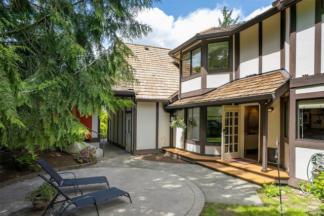 2120 Squak Mountain Loop SW, Issaquah, WA 98027 - back of property featuring stucco siding and a patio area