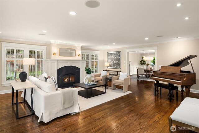 1325 Broadmoor Dr E, Seattle, WA 98112 - living area with recessed lighting, crown molding, a warm lit fireplace, dark wood finished floors, and baseboards