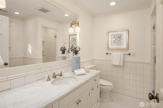 1325 Broadmoor Dr E, Seattle, WA 98112 - full bath featuring tile walls, a shower stall, vanity, toilet, and tile patterned flooring