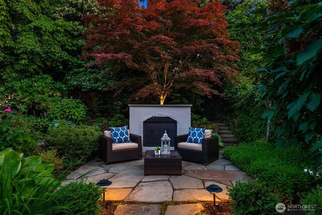 1325 Broadmoor Dr E, Seattle, WA 98112 - view of patio featuring an outdoor living space with a fireplace