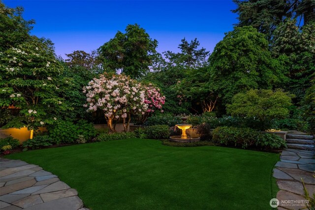 1325 Broadmoor Dr E, Seattle, WA 98112 - yard at dusk featuring a lawn