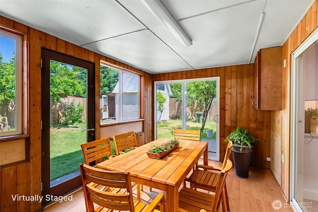 8048 S Ainsworth Ave, Tacoma, WA 98408 - sunroom / solarium featuring wood finished floors, healthy amount of natural light, and wooden walls