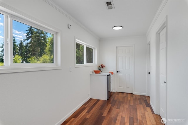 8048 S Ainsworth Ave, Tacoma, WA 98408 - hallway with baseboards, dark wood-style flooring, and ornamental molding