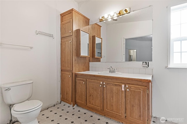 8530 Steilacoom Rd SE Unit 113, Olympia, WA 98513 - bathroom with toilet, vanity, and tile patterned floors