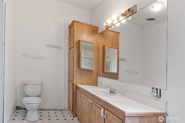 8530 Steilacoom Rd SE Unit 113, Olympia, WA 98513 - bathroom with toilet, vanity, and tile patterned floors