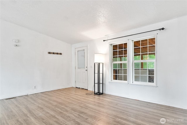8530 Steilacoom Rd SE Unit 113, Olympia, WA 98513 - empty room with wood finished floors and baseboards