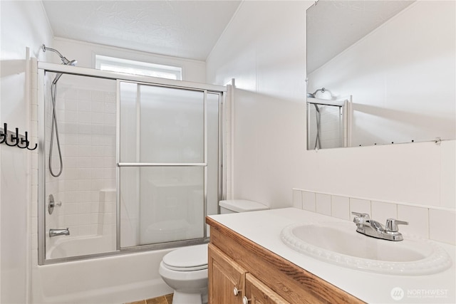 8530 Steilacoom Rd SE Unit 113, Olympia, WA 98513 - full bathroom featuring toilet, vanity, and shower / bath combination with glass door
