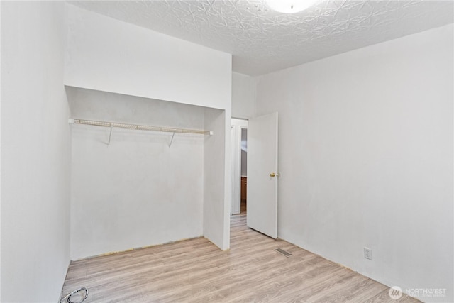 8530 Steilacoom Rd SE Unit 113, Olympia, WA 98513 - unfurnished bedroom with a closet and wood finished floors