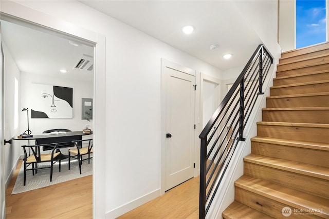 4515 44th Ave SW Unit A, Seattle, WA 98116 - stairway with wood finished floors, baseboards, and recessed lighting